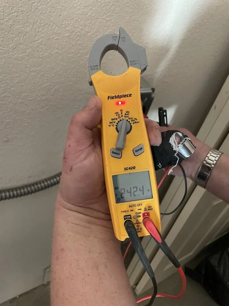 Voltage testing with clamp meter during Outlet Installation in Roseville